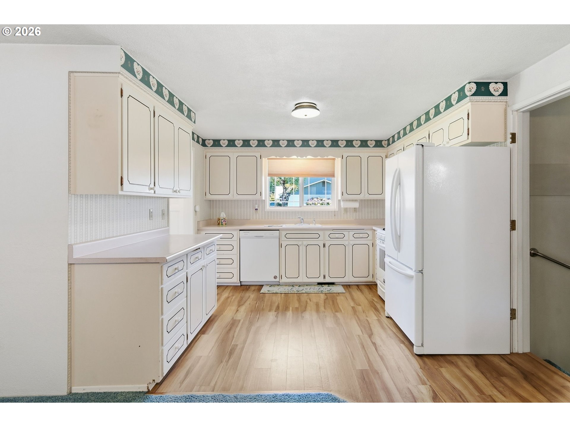 2494 38th Street Springfield, OR 97477 - Photo 10 of 38 a kitchen with a refrigerator a sink and cabinets