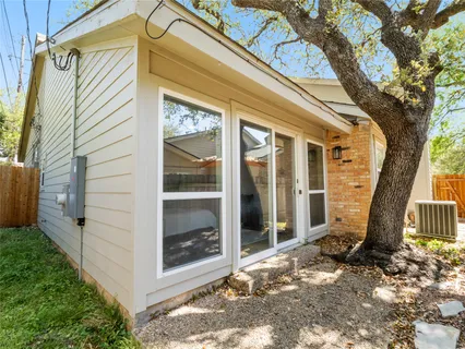 a view of front door and small yard