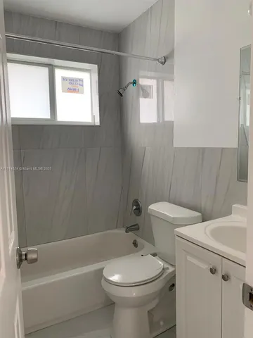 a bathroom with a sink a toilet and a bathtub