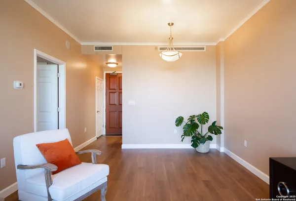 a view of room with furniture and wooden floor