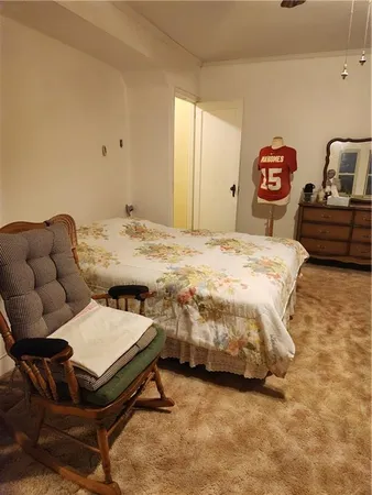 a bedroom with a bed and a table