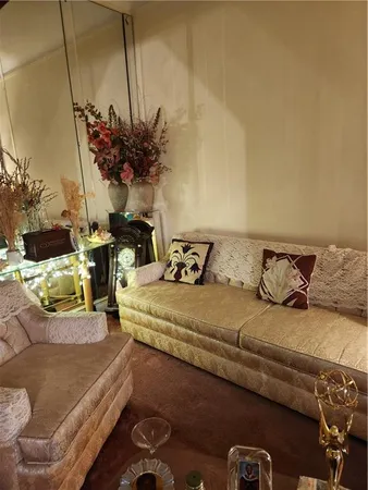 a view of living room with furniture and flowers