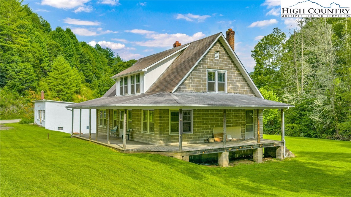 949 Coy Ham Road Lansing, NC 28643 - Photo 14 of 48 front view of a house with a yard