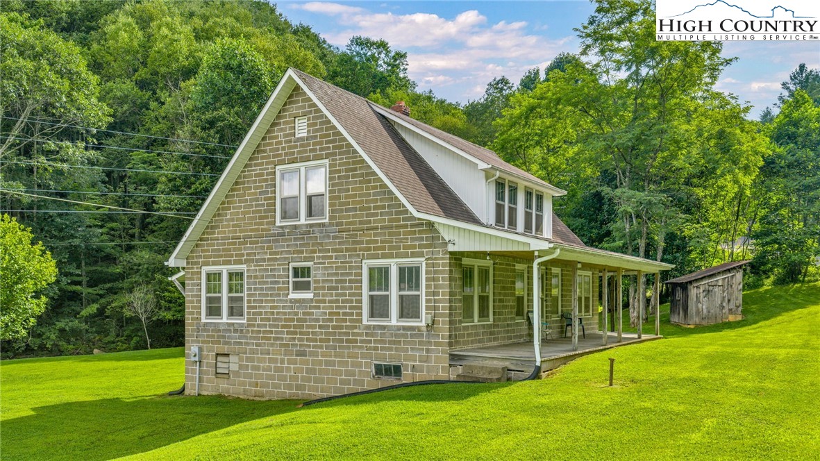 949 Coy Ham Road Lansing, NC 28643 - Photo 15 of 48 a view of a house with a yard