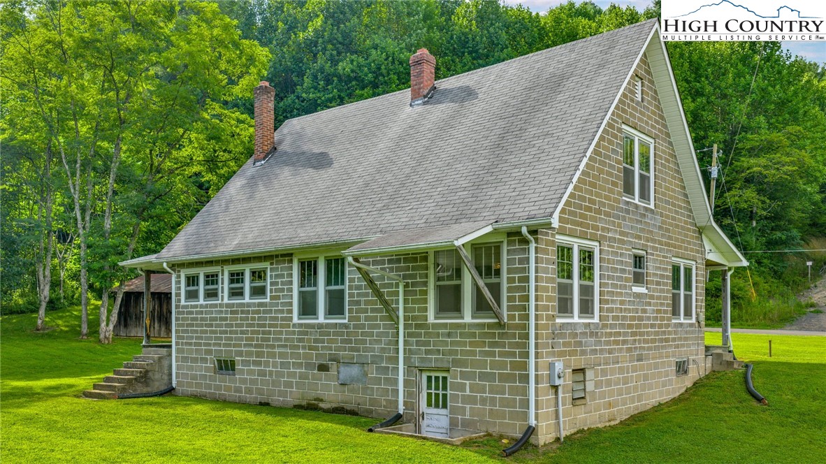 949 Coy Ham Road Lansing, NC 28643 - Photo 18 of 48 a aerial view of a house with a yard