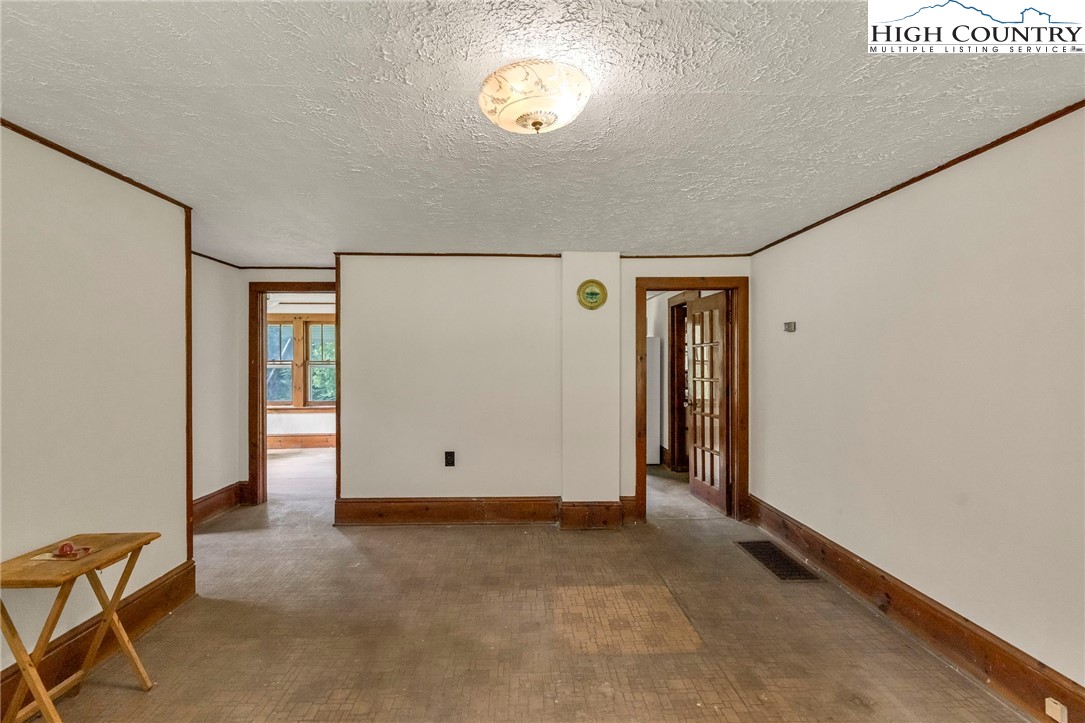 949 Coy Ham Road Lansing, NC 28643 - Photo 19 of 48 a view of an empty room with a window