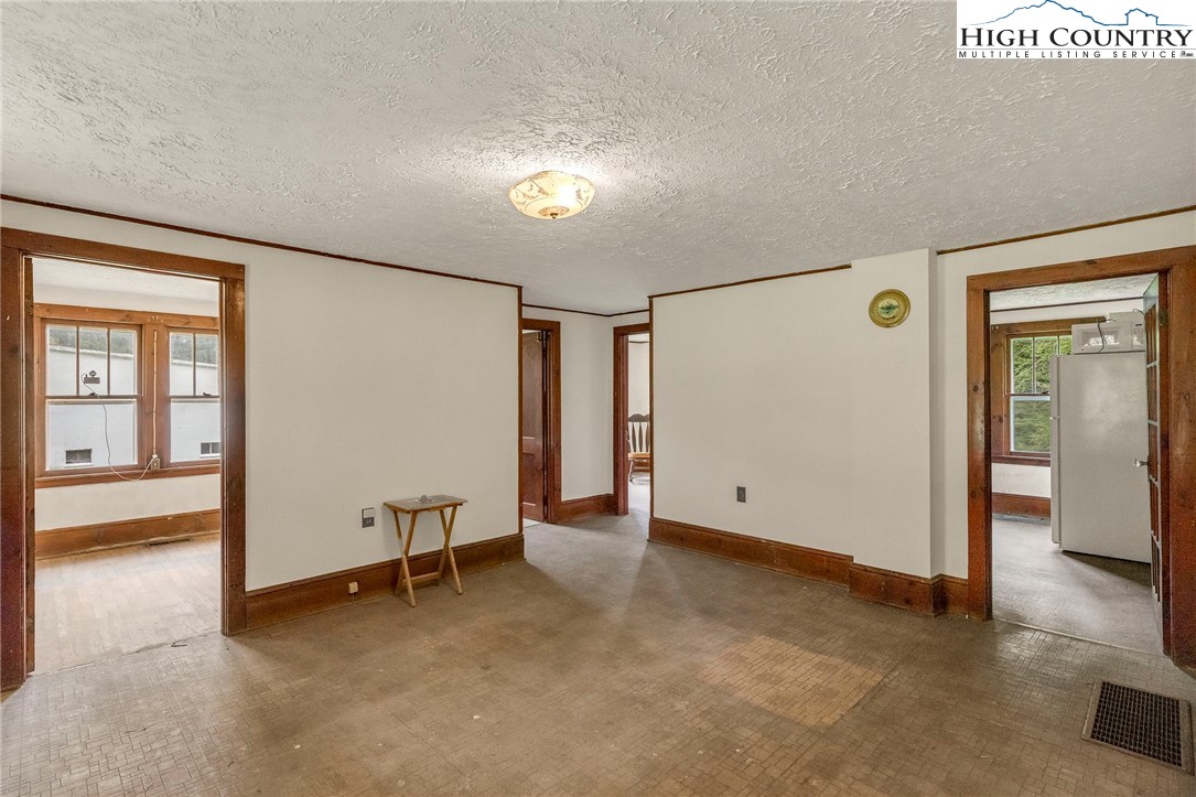 949 Coy Ham Road Lansing, NC 28643 - Photo 20 of 48 a view of empty room with wooden floor