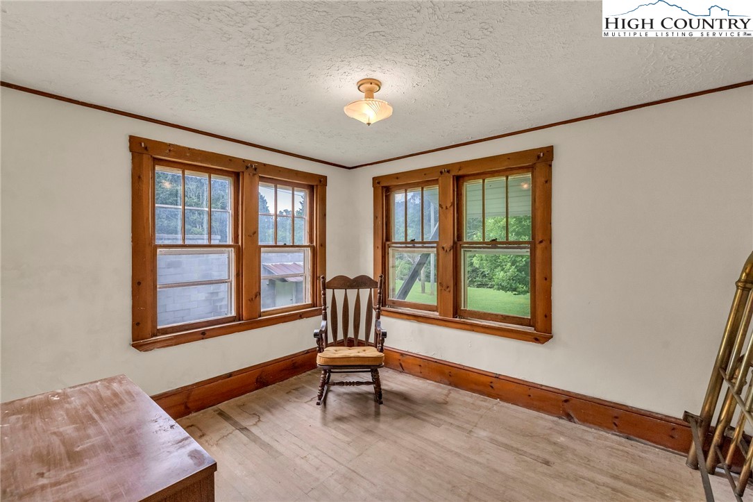 949 Coy Ham Road Lansing, NC 28643 - Photo 22 of 48 a living room with furniture and a window
