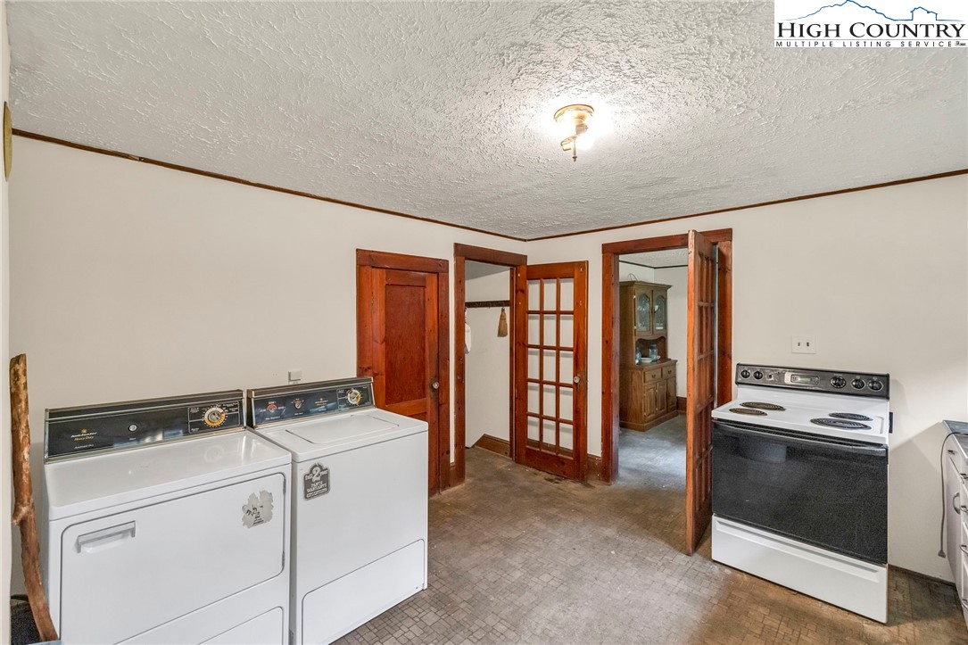 949 Coy Ham Road Lansing, NC 28643 - Photo 25 of 48 a utility room with dryer and washer