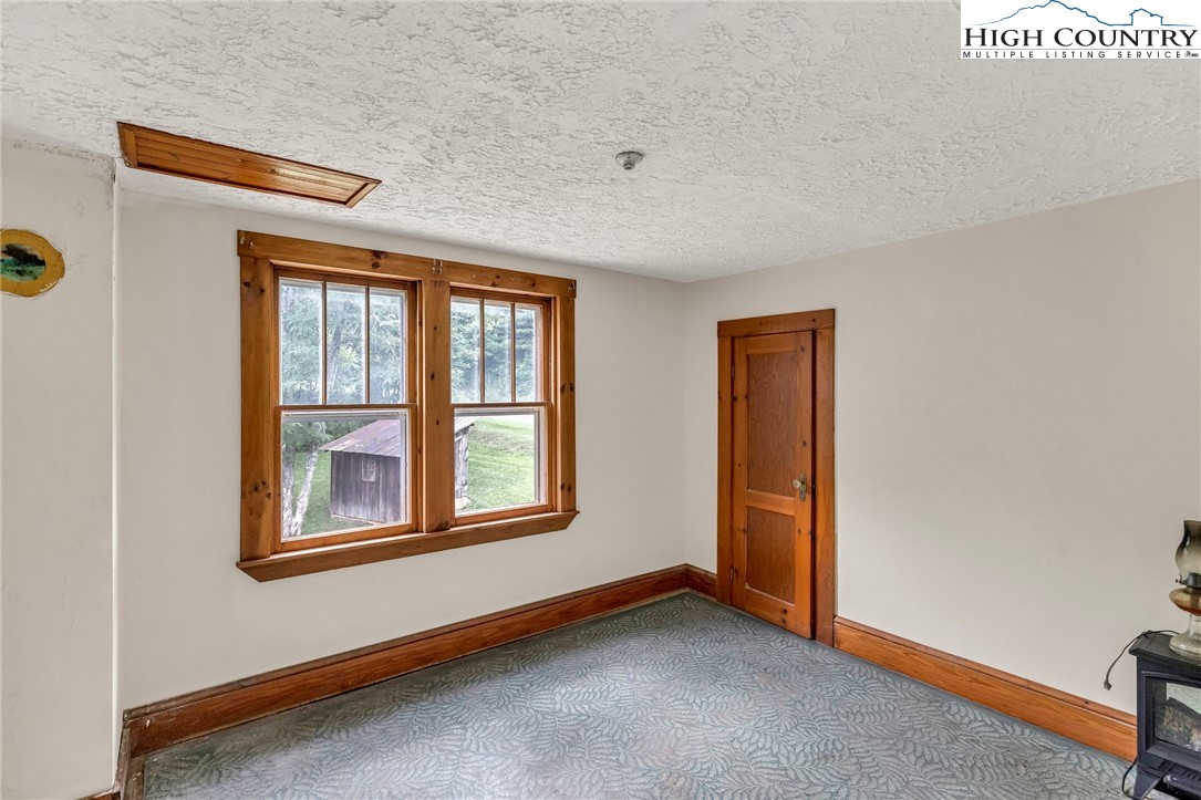 949 Coy Ham Road Lansing, NC 28643 - Photo 30 of 48 a view of an empty room with a window