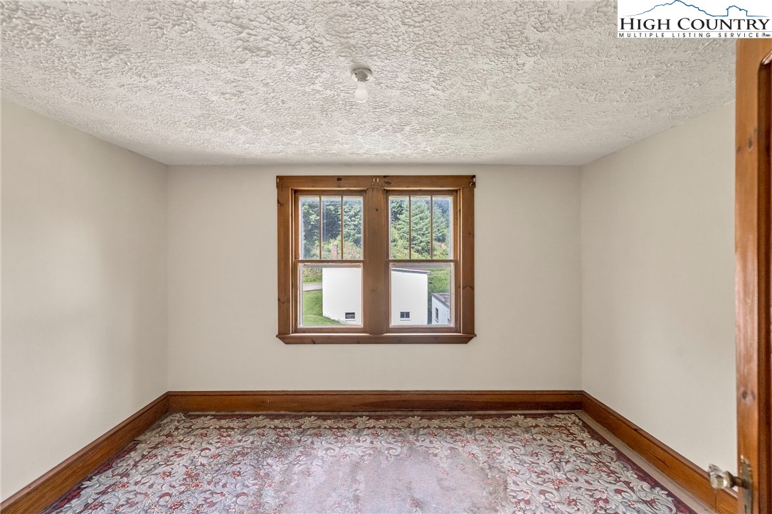 949 Coy Ham Road Lansing, NC 28643 - Photo 33 of 48 a view of an empty room with a window