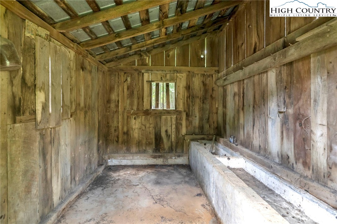 949 Coy Ham Road Lansing, NC 28643 - Photo 44 of 48 a view of a bathroom with a tub and shower
