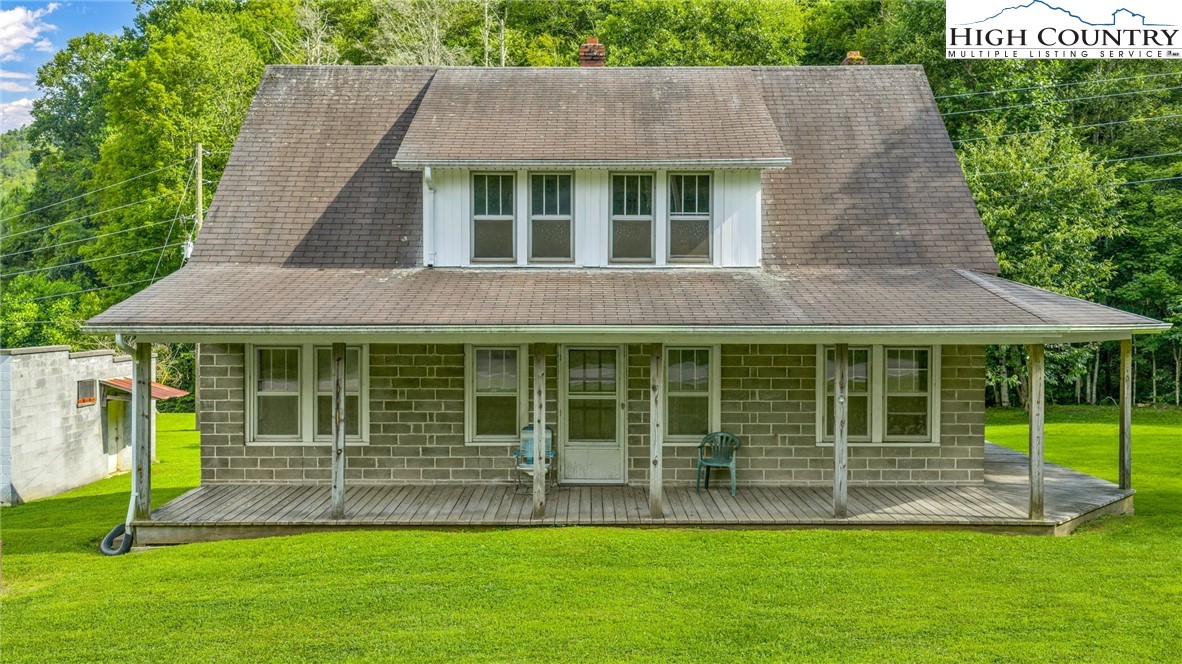 949 Coy Ham Road Lansing, NC 28643 - Photo 5 of 48 a house view with a garden space