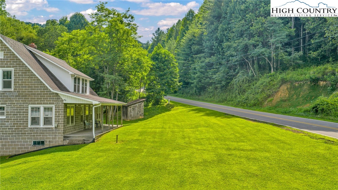 949 Coy Ham Road Lansing, NC 28643 - Photo 6 of 48 a view of a house with pool