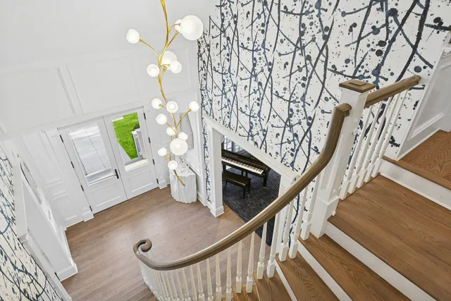a view of an entryway with wooden floor