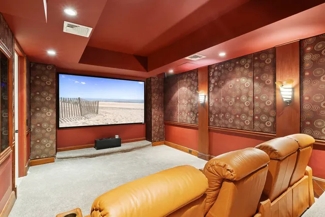 a living room with blue lights with furniture