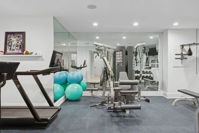 a living room with furniture and flat screen tv