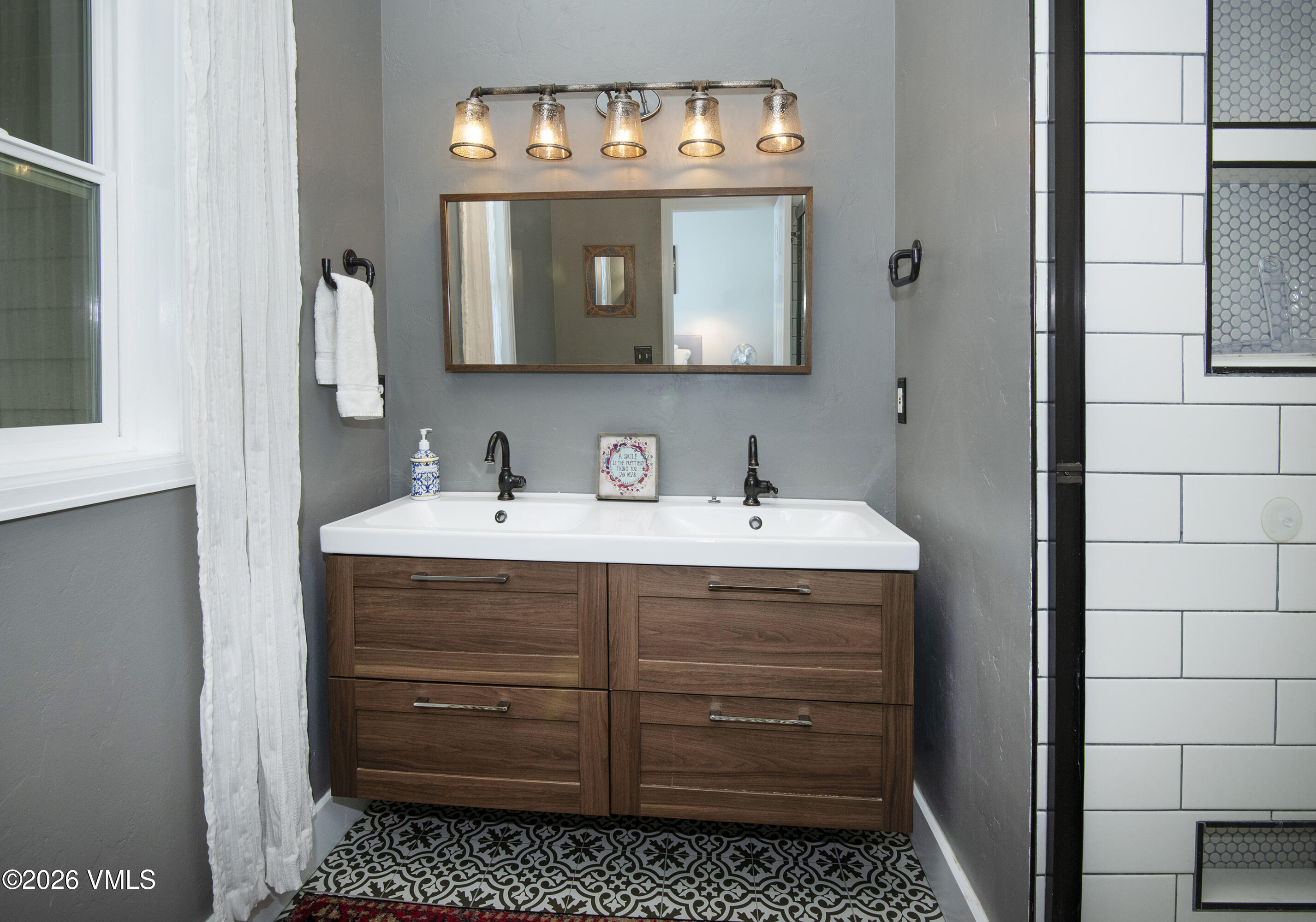 83 Arlington Place, Unit A2 Edwards, CO 81632 - Photo 13 of 19 a bathroom with a sink and a mirror