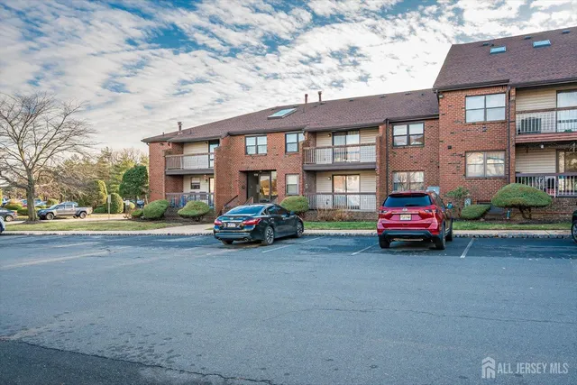 a car parked in front of a brick building
