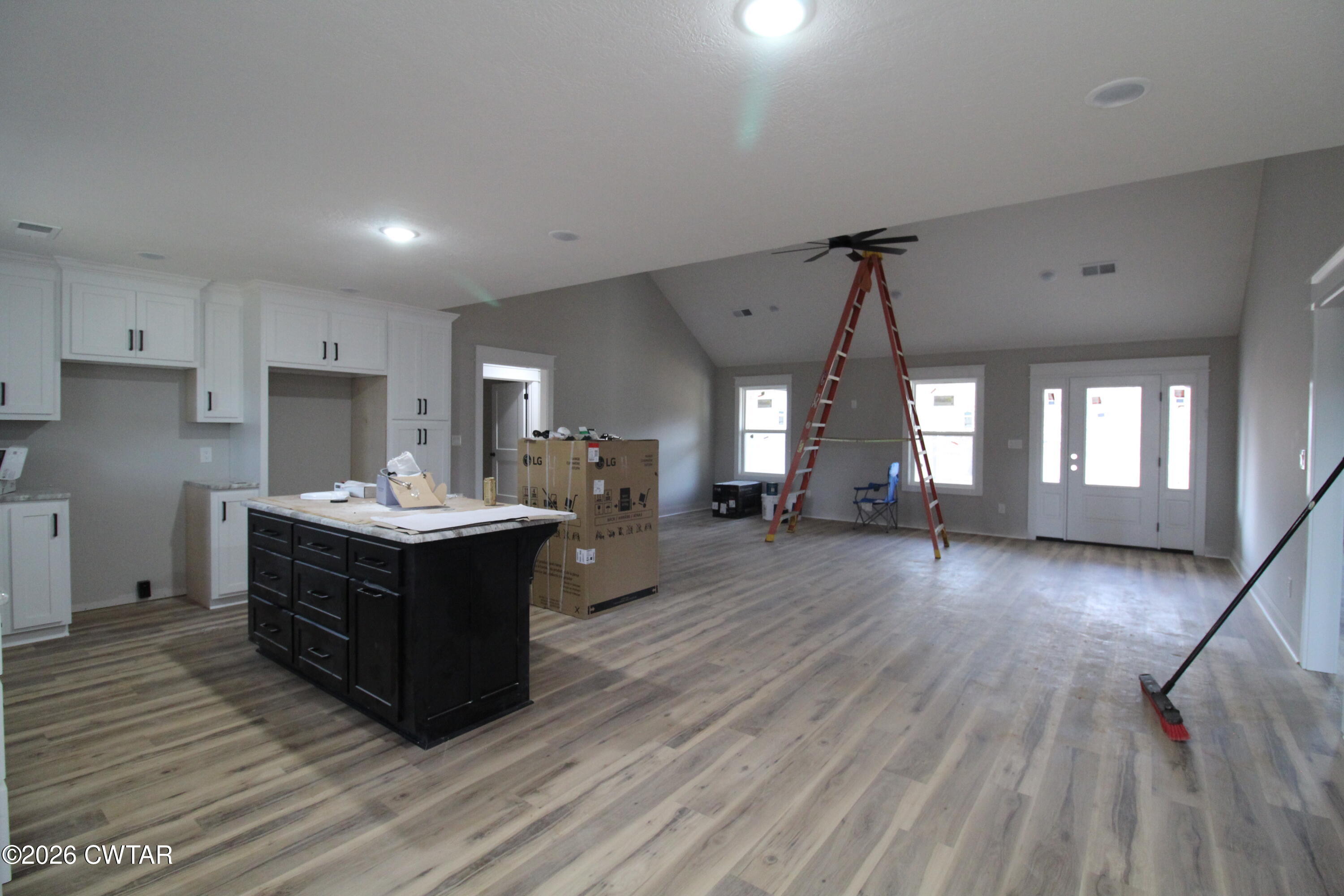 440 Oak Point Drive Lexington, TN 38351 - Photo 3 of 14 a kitchen with sink cabinets and wooden floor