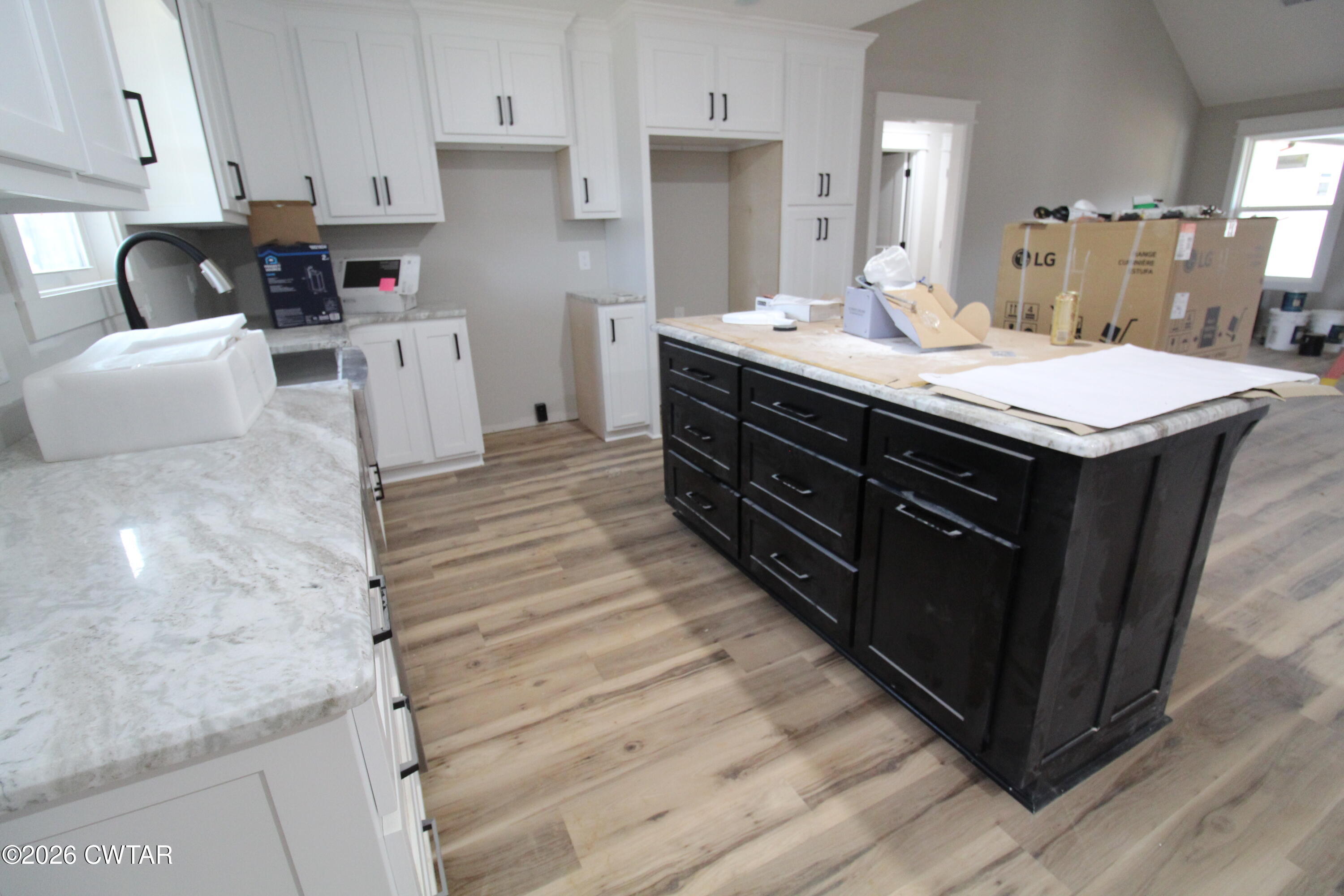 440 Oak Point Drive Lexington, TN 38351 - Photo 5 of 14 a kitchen with a sink and cabinets