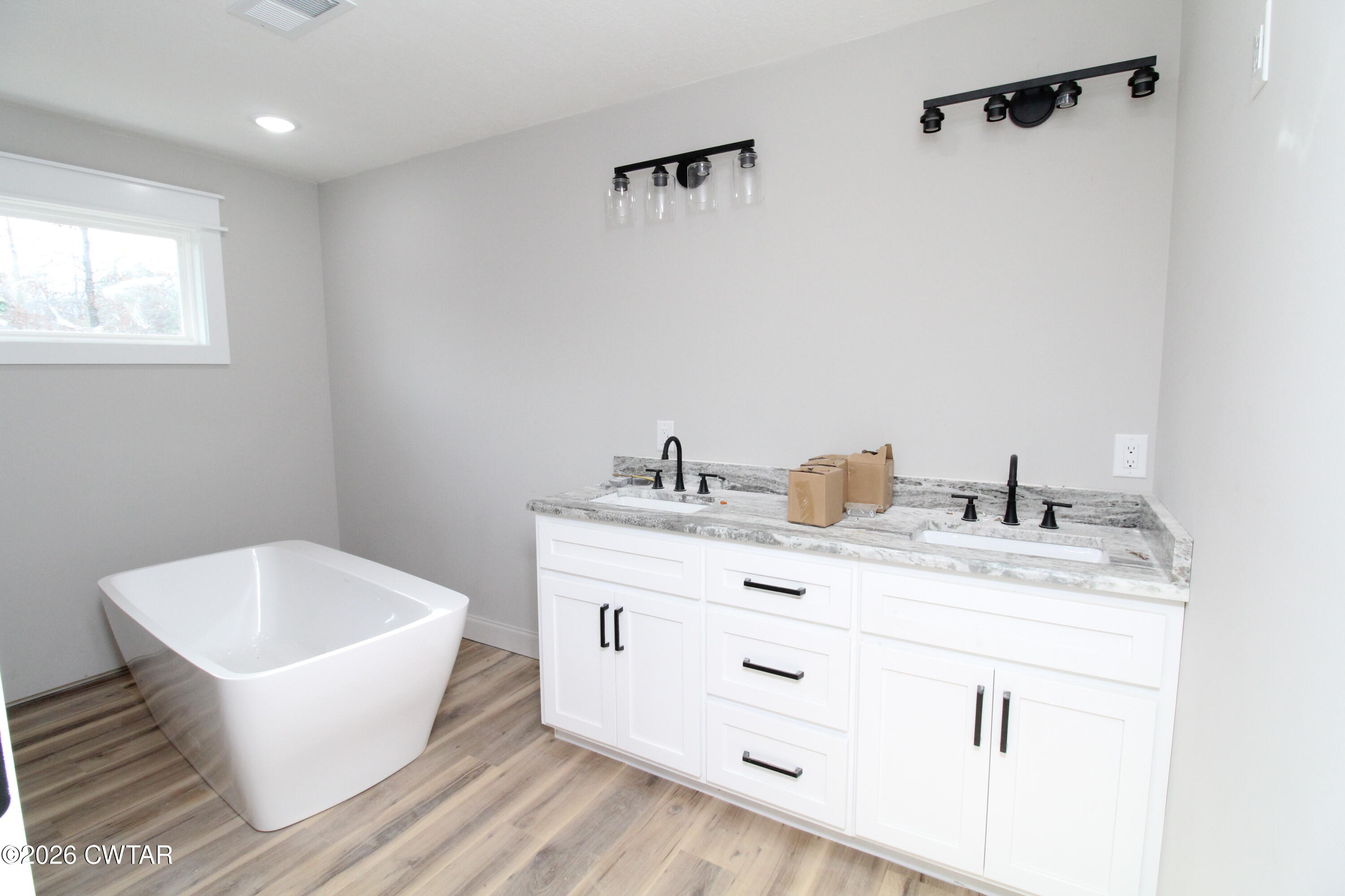 440 Oak Point Drive Lexington, TN 38351 - Photo 9 of 14 a bathroom with a granite countertop sink mirror and vanity