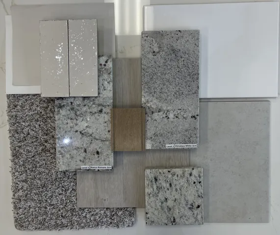 a view of a house with a small yard plants and large tree