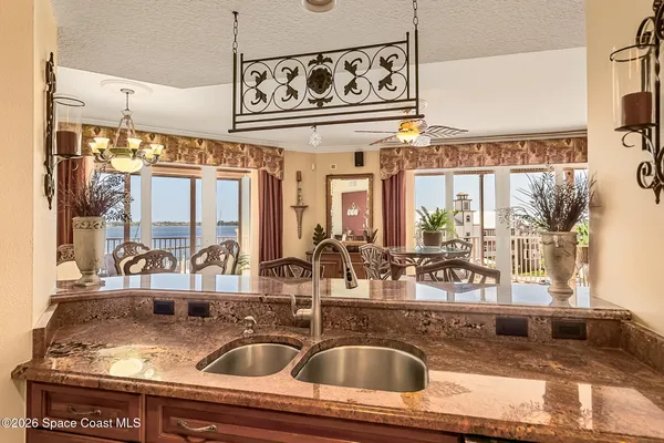 a bedroom with a bed a desk and chair