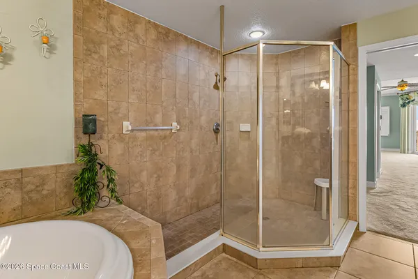 a view of balcony with furniture and floor to ceiling window