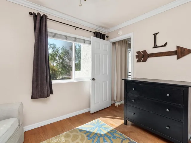 a room with a dresser and a window