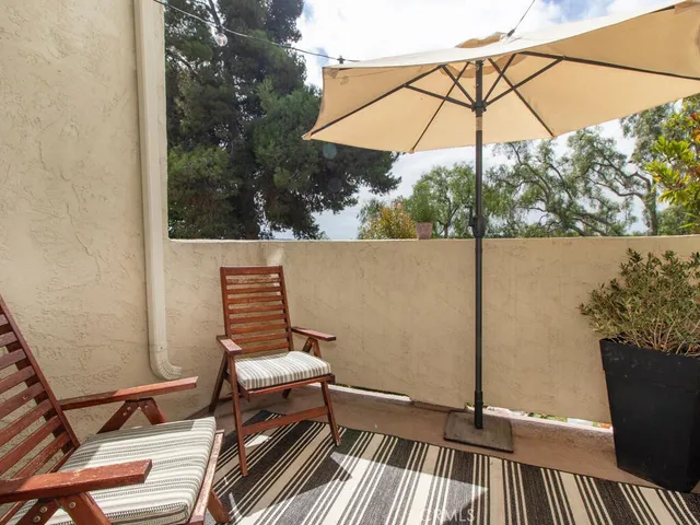 a view of balcony with furniture