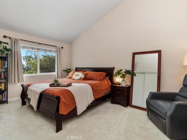 a bed room with a bed and a couch