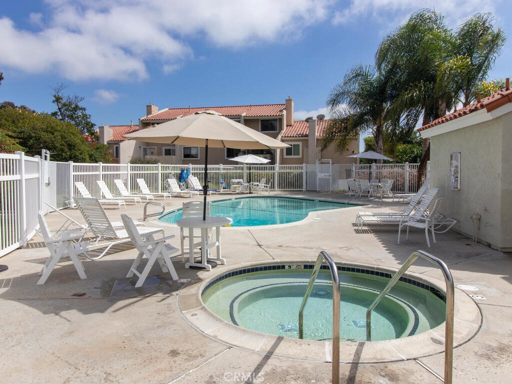6907 Quail Place, Unit F Carlsbad, CA 92009 - Photo 23 of 24 an outdoor space with furniture and umbrella