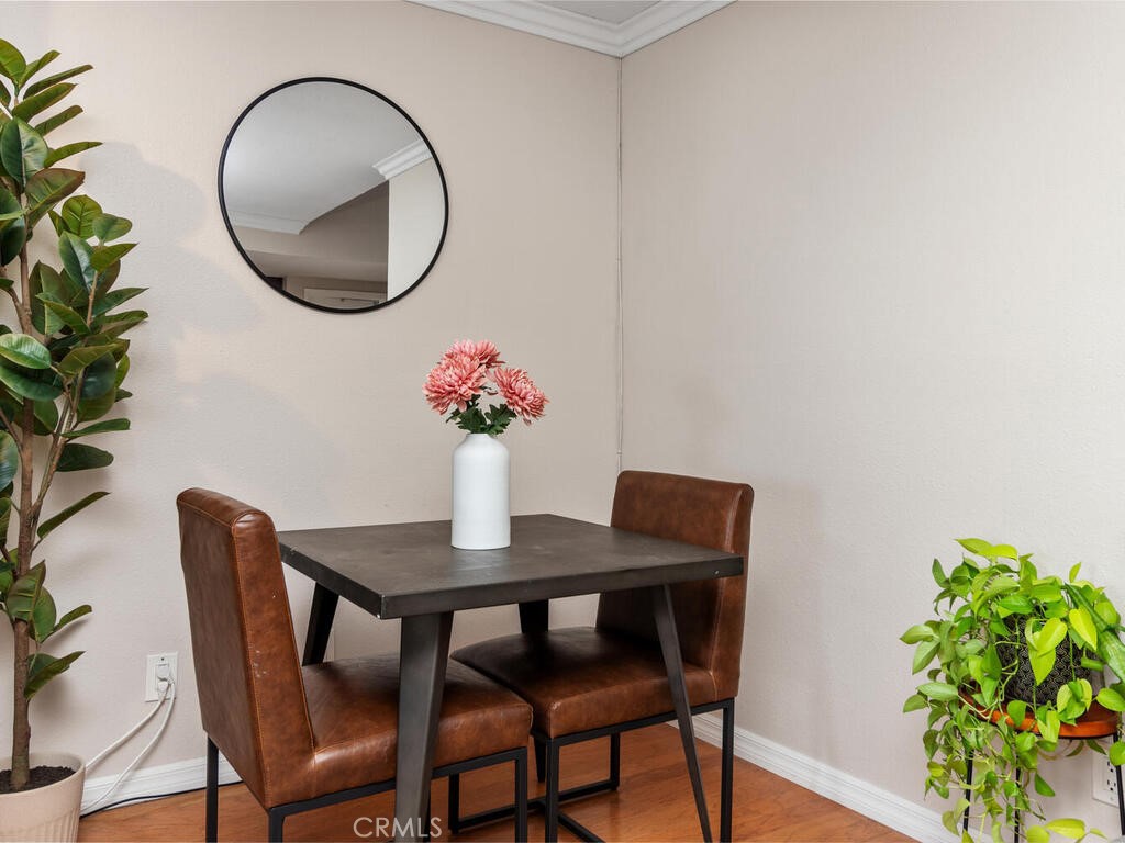 6907 Quail Place, Unit F Carlsbad, CA 92009 - Photo 8 of 24 a dining room with furniture and a mirror