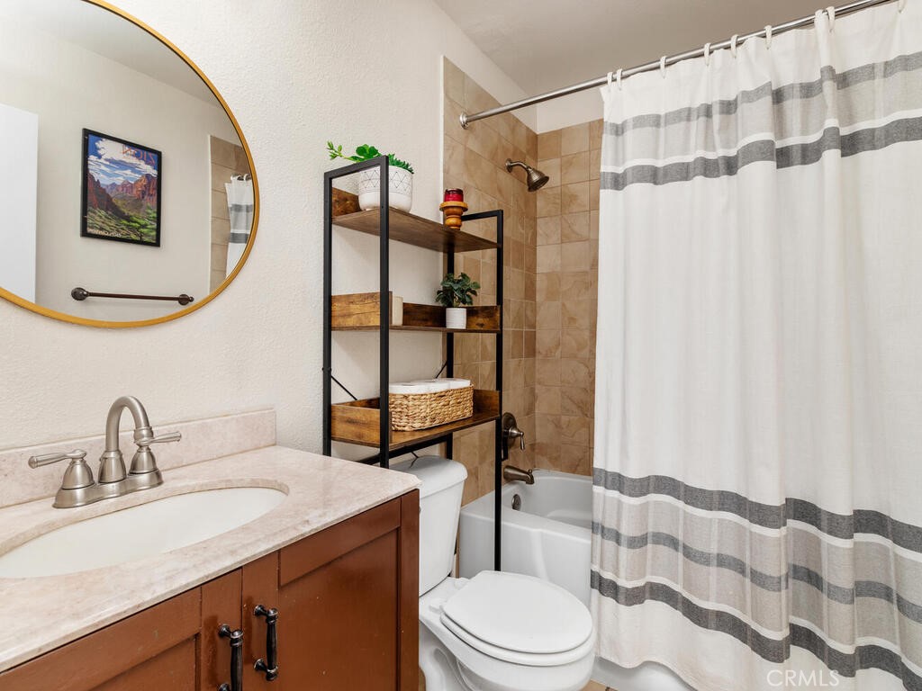 6907 Quail Place, Unit F Carlsbad, CA 92009 - Photo 9 of 24 a bathroom with a sink toilet and shower
