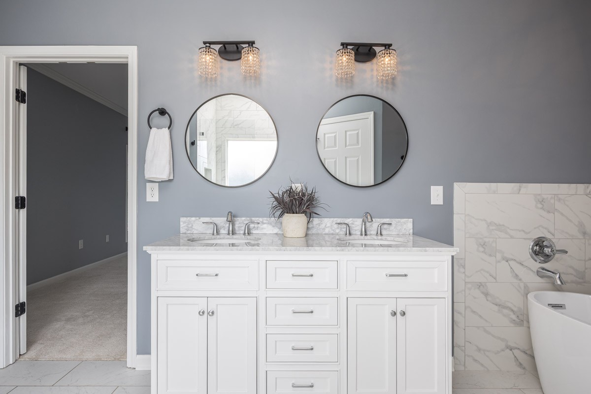 3002 Sakari Circle Spring Hill, TN 37174 - Photo 26 of 56 a bathroom with a granite countertop double vanity sink and a mirror