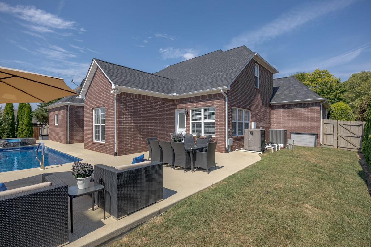 3002 Sakari Circle Spring Hill, TN 37174 - Photo 55 of 56 a front view of house with yard outdoor seating and barbeque in front of it