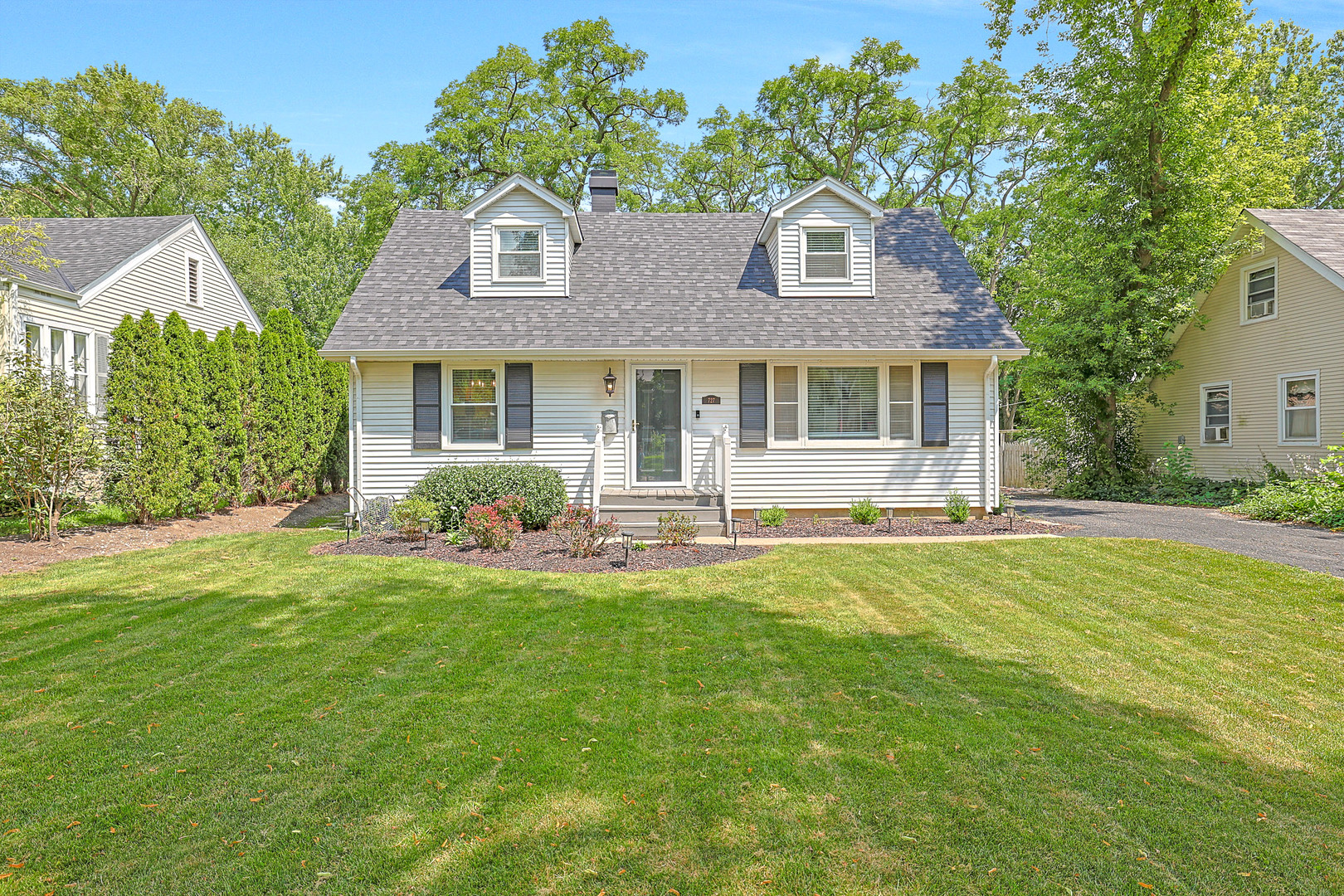 727 South Cook Street Barrington, IL 60010 - Photo 1 of 26 a front view of a house with a yard