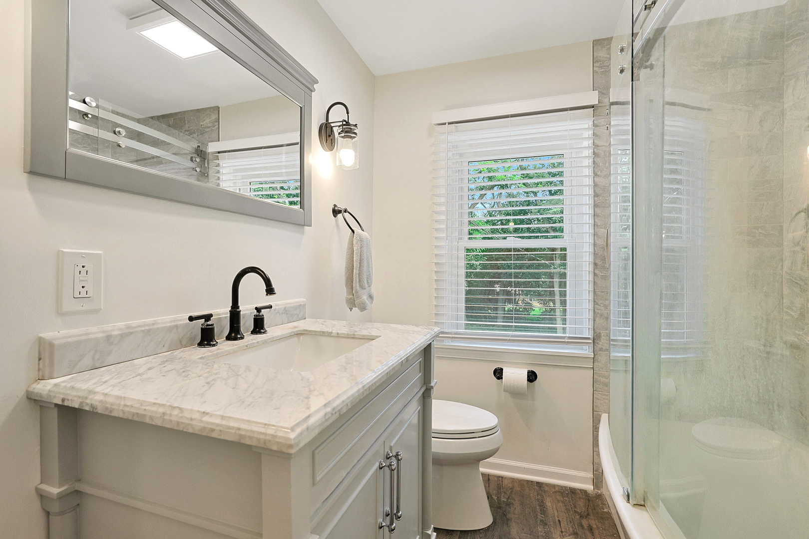 727 South Cook Street Barrington, IL 60010 - Photo 11 of 26 a bathroom with a granite countertop sink a toilet and shower