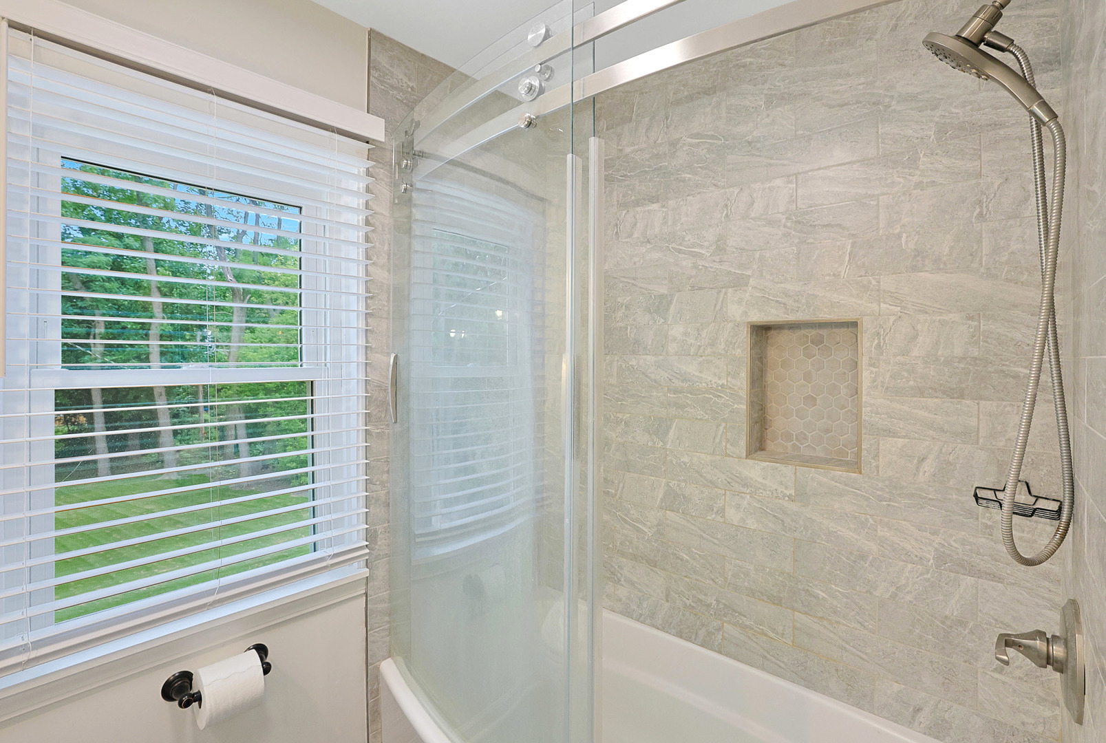 727 South Cook Street Barrington, IL 60010 - Photo 12 of 26 a bathroom with a shower and a tub