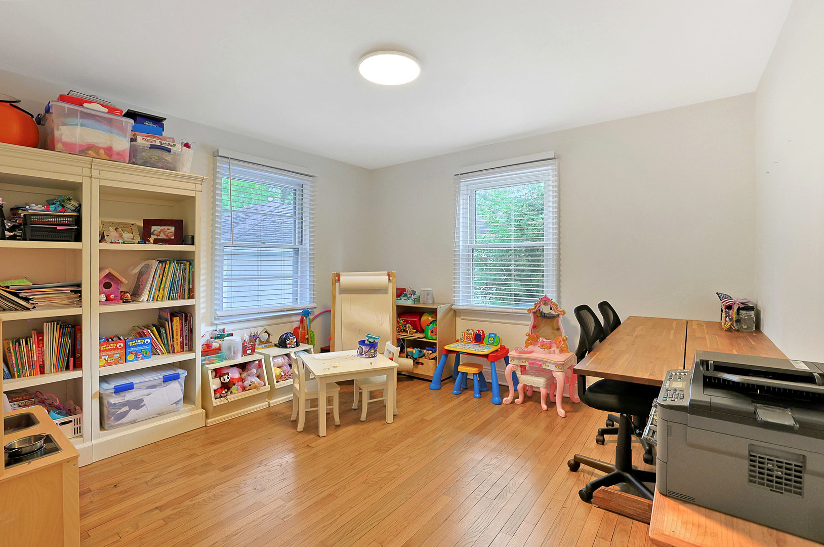 727 South Cook Street Barrington, IL 60010 - Photo 13 of 26 a work room with furniture and a wooden floor