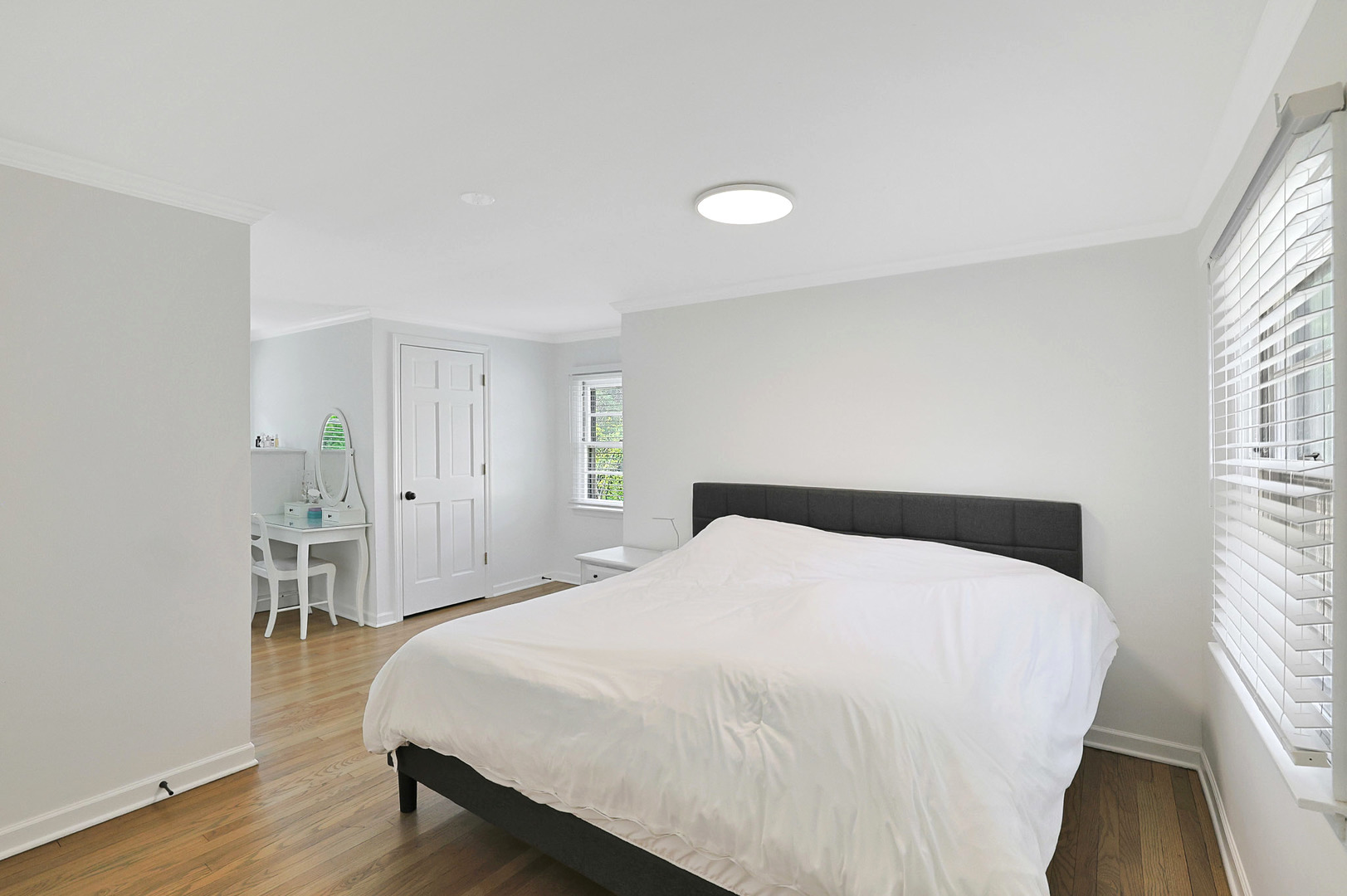 727 South Cook Street Barrington, IL 60010 - Photo 15 of 26 a bedroom with a bed and wooden floor