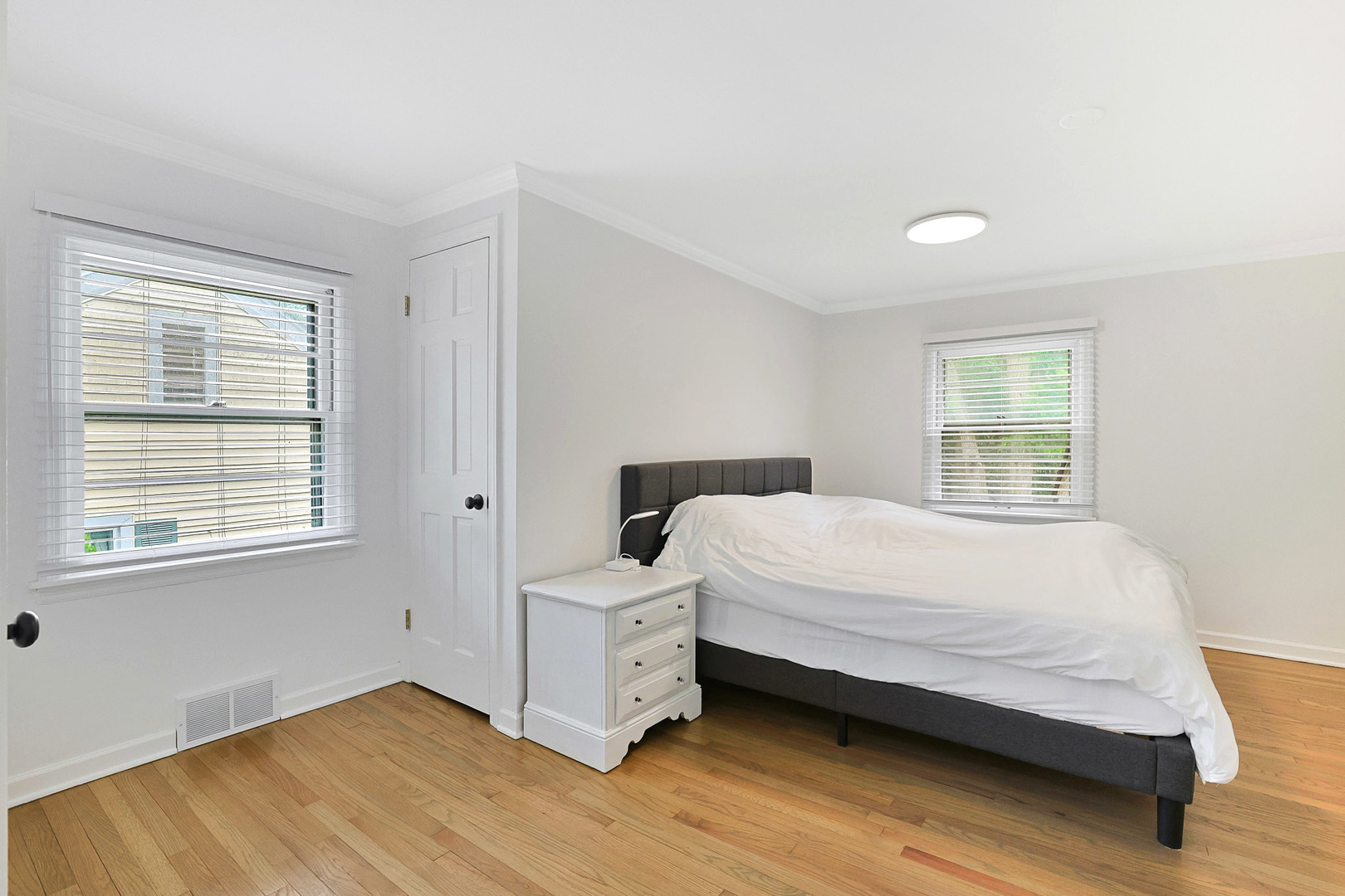 727 South Cook Street Barrington, IL 60010 - Photo 17 of 26 a bedroom with a bed and window
