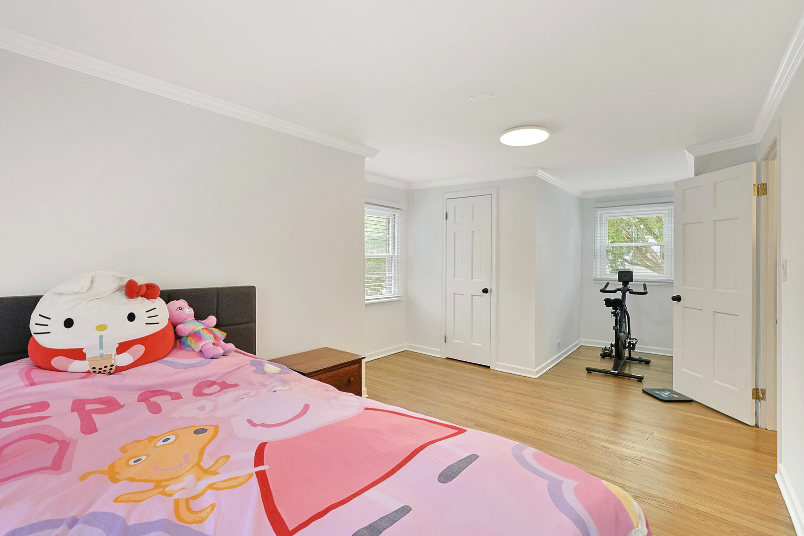 727 South Cook Street Barrington, IL 60010 - Photo 19 of 26 a bedroom with a bed and wooden floor