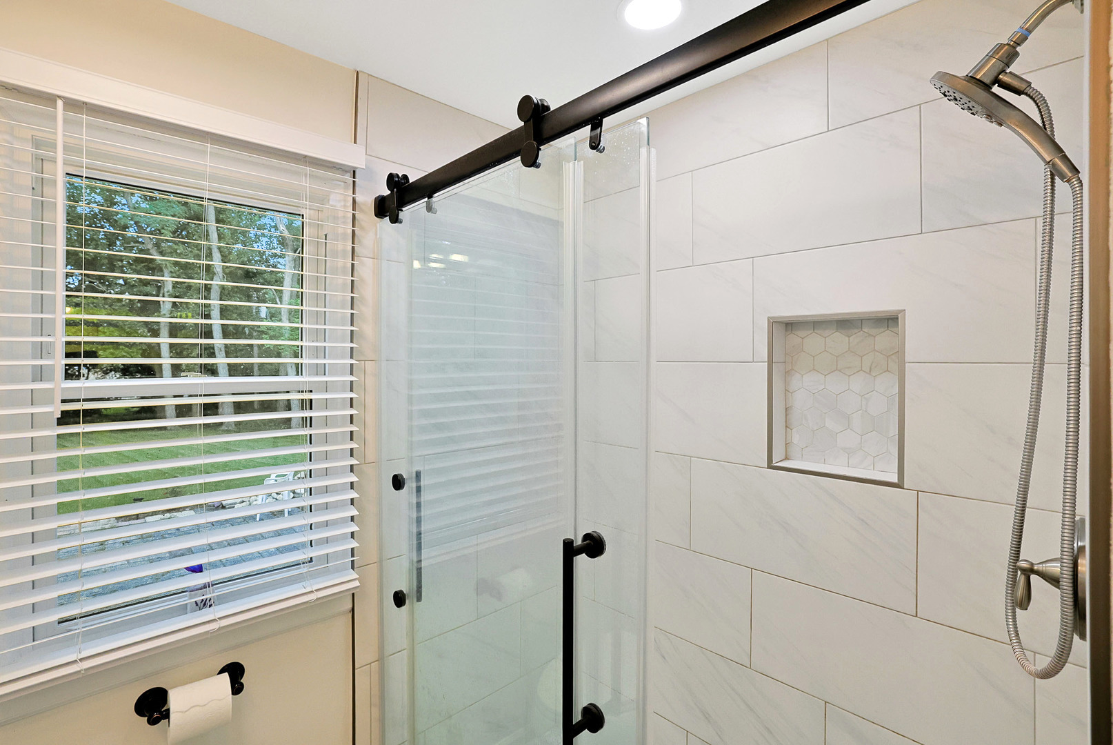 727 South Cook Street Barrington, IL 60010 - Photo 21 of 26 a bathroom with a shower and a window