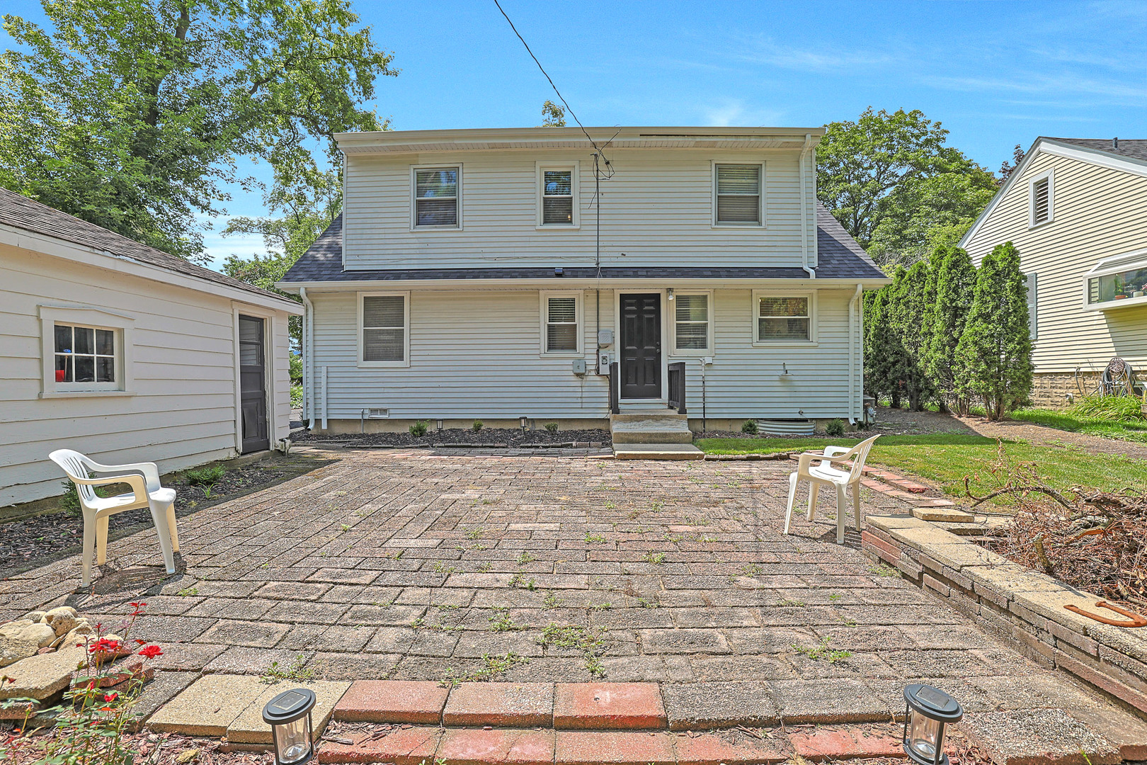 727 South Cook Street Barrington, IL 60010 - Photo 26 of 26 a front view of a house with a yard