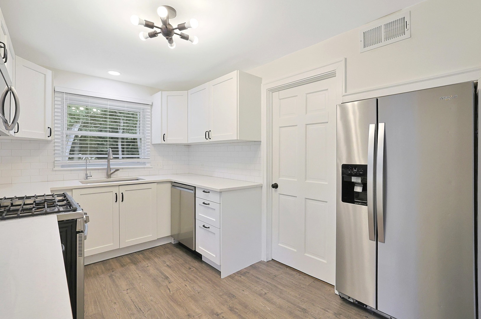 727 South Cook Street Barrington, IL 60010 - Photo 9 of 26 a kitchen with stainless steel appliances a refrigerator sink and cabinets