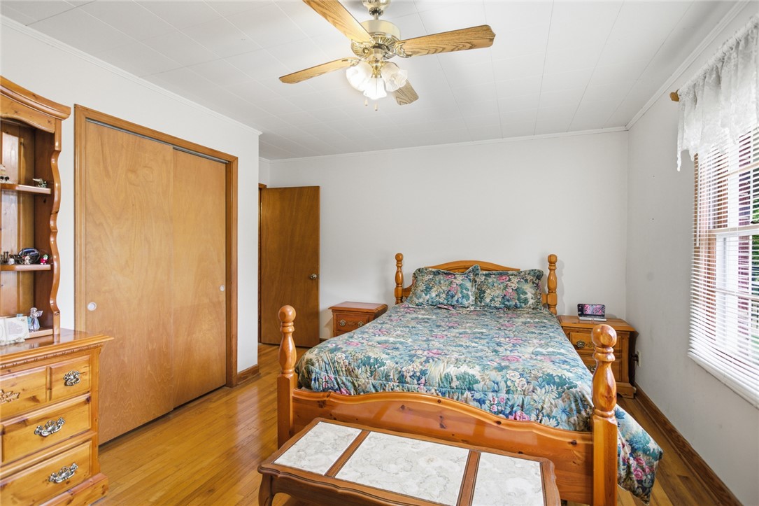 282 West Bennett Road Westminster, SC 29693 - Photo 14 of 42 This cozy bedroom features polished wood floors and a convenient ceiling fan for comfort.