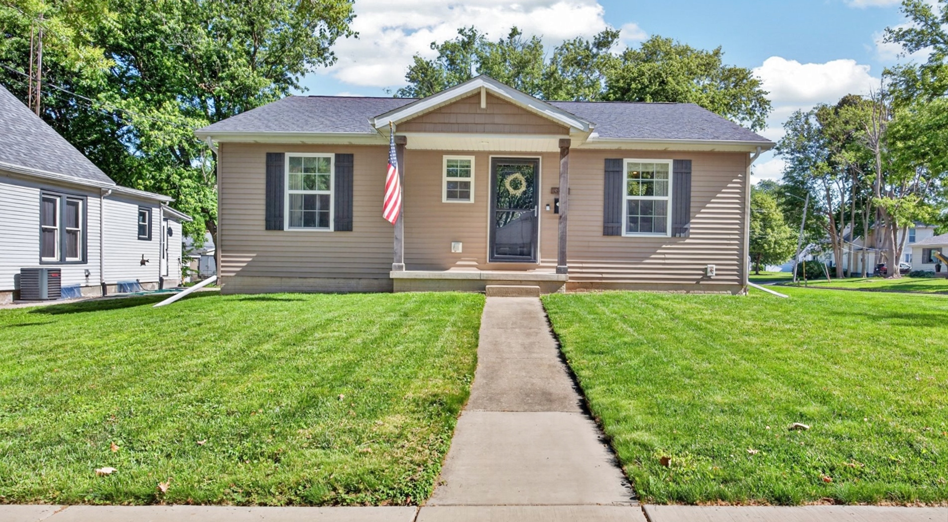 308 East Locust Street Normal, IL 61761 - Photo 2 of 40 a front view of a house with a yard and green space