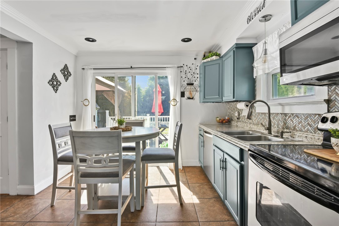 142 Lyndon Road Cranston, RI 02905 - Photo 9 of 27 142 Lyndon Rd Cranston RI 02920 - kitchen with slider to deck